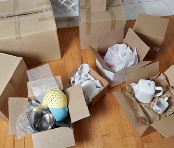 Cardboard boxes full of kitchenware - storage top tips